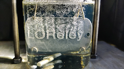 Dehydrogenation of LOHC with a laserstructured and platinum sputtered Aluminiumplate showing the LOReley logo